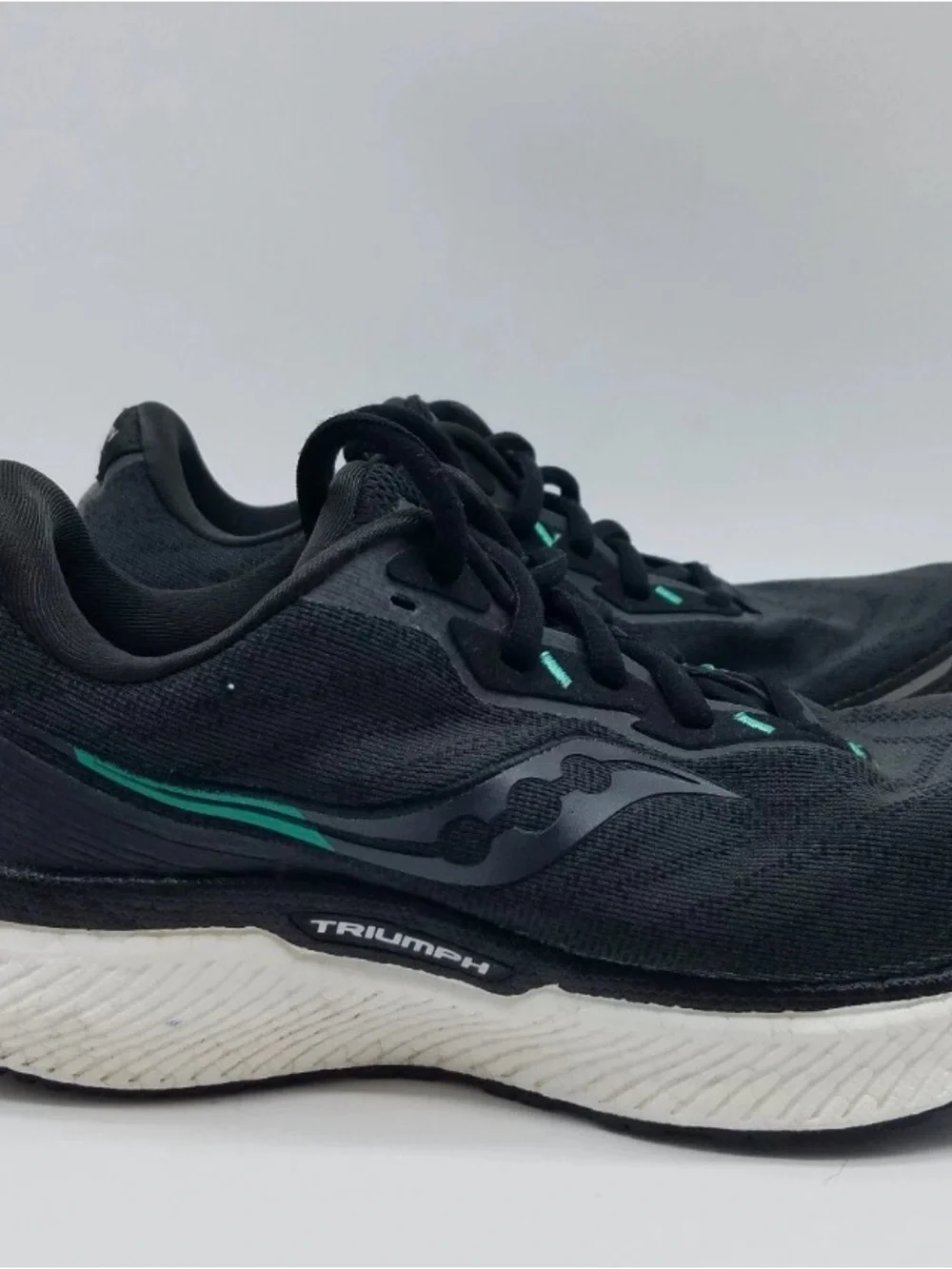 Saucony Black Running Shoes with Teal Accents
